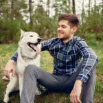 Handsome guy summer park with dog